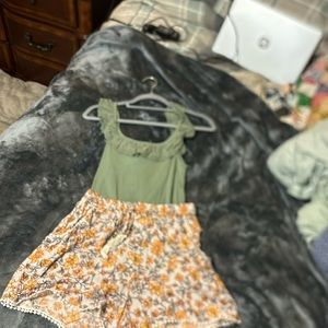 Sage green top with floral matching shorts. Never worn.